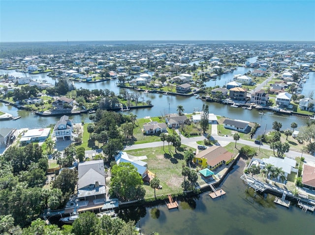 birds eye view of property with a residential view and a water view