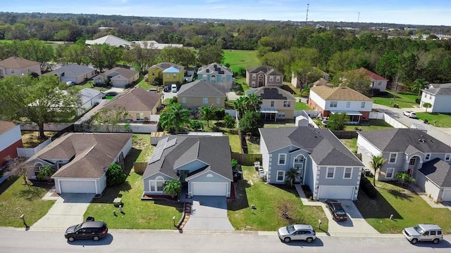 birds eye view of property with a residential view