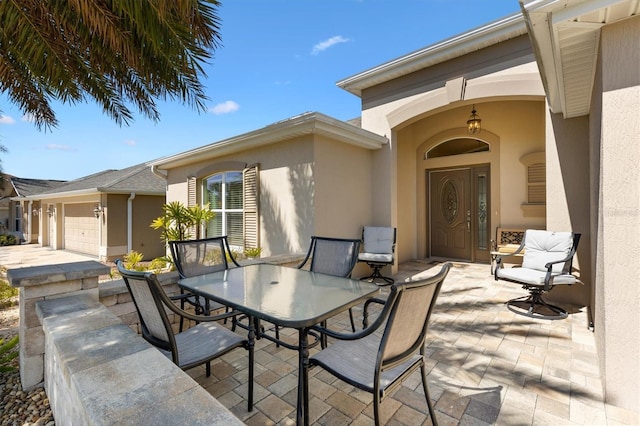 view of patio featuring outdoor dining area