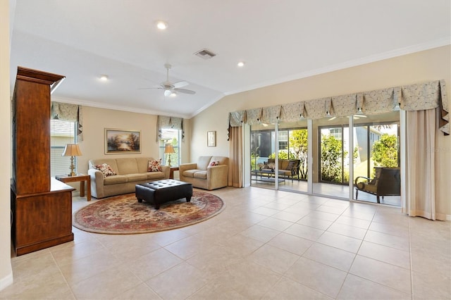 living room with ornamental molding, visible vents, and a healthy amount of sunlight