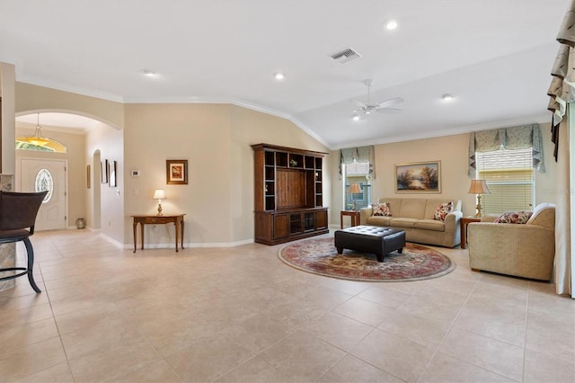 living area with visible vents, arched walkways, lofted ceiling, ceiling fan, and crown molding