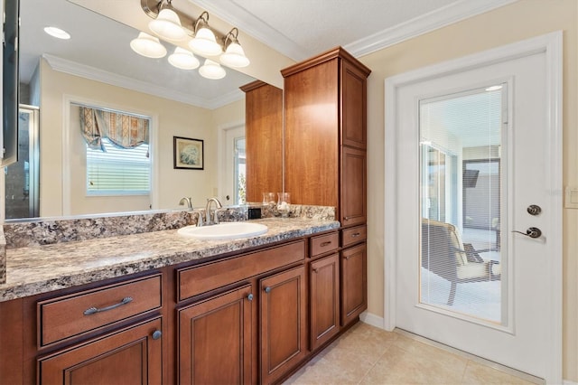 bathroom with tile patterned flooring, crown molding, and vanity