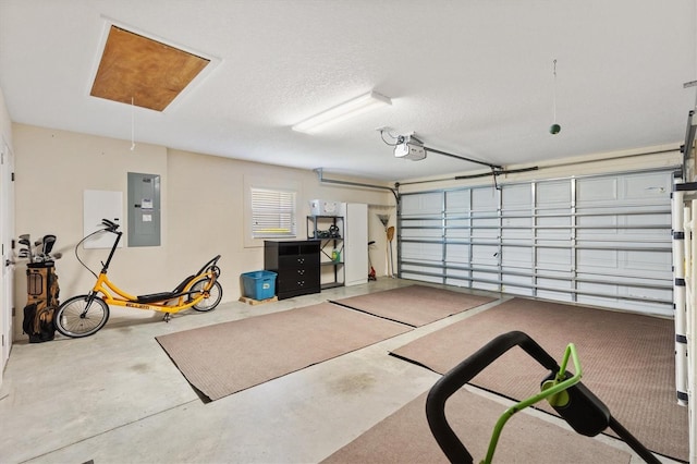 garage with electric panel and a garage door opener