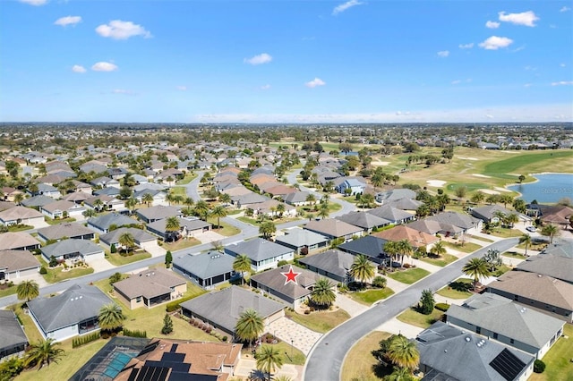 bird's eye view featuring a water view and a residential view