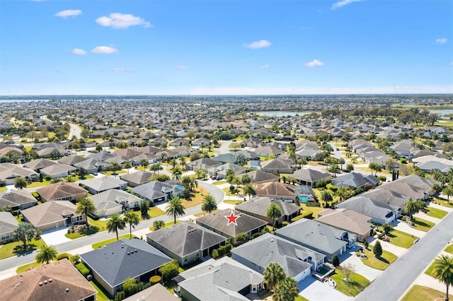 birds eye view of property with a residential view