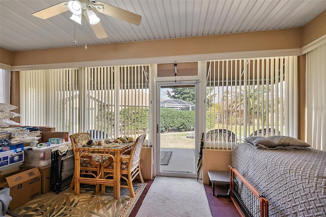 sunroom / solarium with a ceiling fan