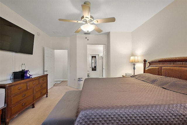 bedroom featuring visible vents, a ceiling fan, and light colored carpet