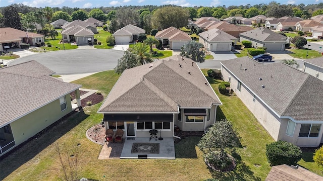 birds eye view of property with a residential view