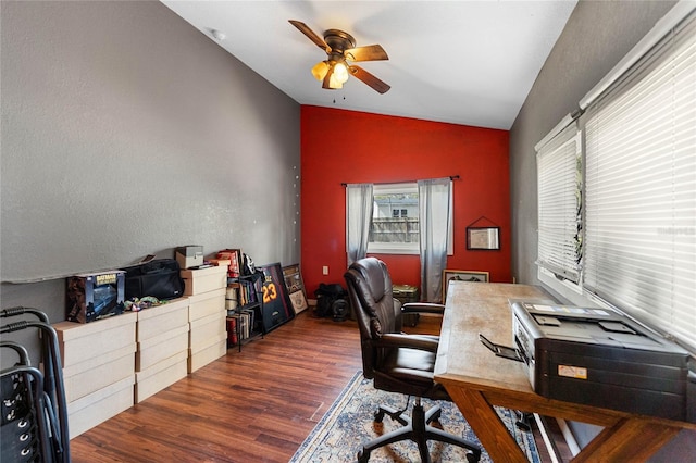 office space featuring vaulted ceiling, ceiling fan, and wood finished floors