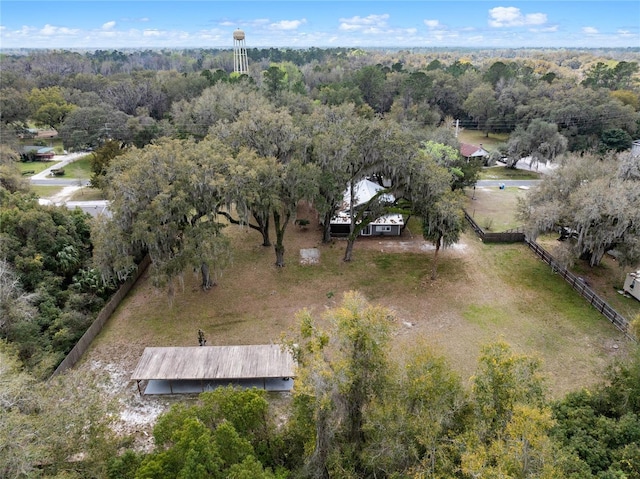 birds eye view of property featuring a rural view and a view of trees