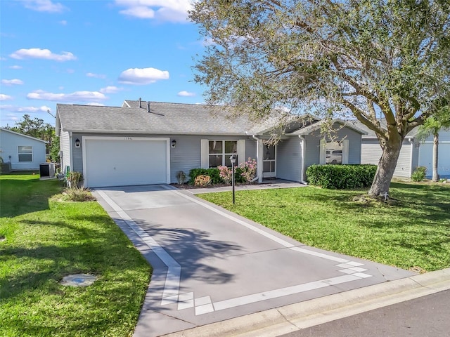 ranch-style house with a front yard, driveway, and an attached garage