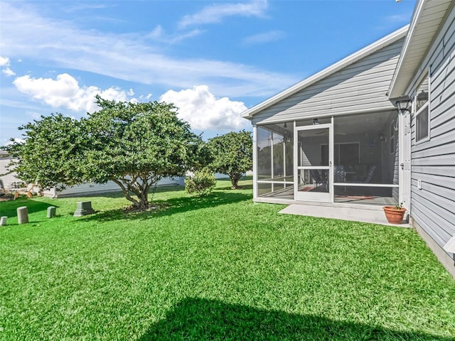 view of yard with a sunroom