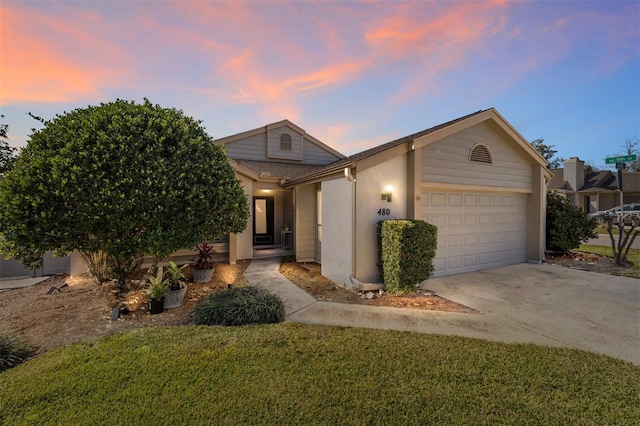 view of front facade with a garage and driveway