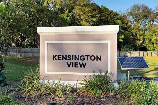 community sign with fence