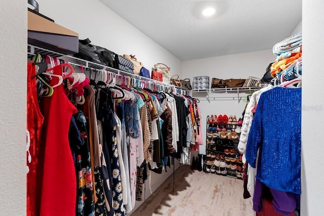 spacious closet featuring wood finished floors