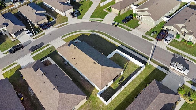 birds eye view of property with a residential view