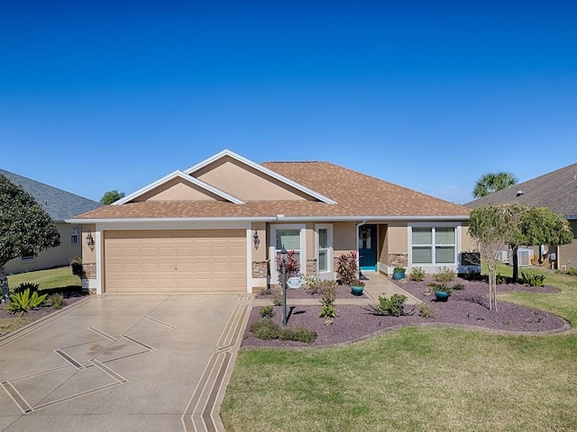 single story home with driveway, a garage, a front lawn, and stucco siding