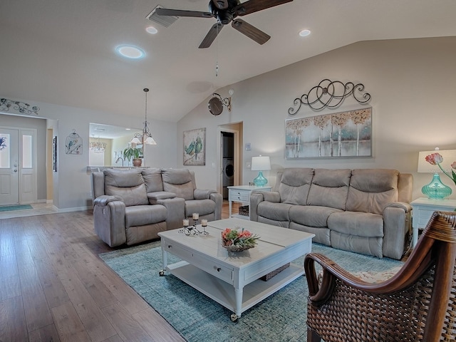 living area featuring baseboards, lofted ceiling, wood-type flooring, ceiling fan, and recessed lighting