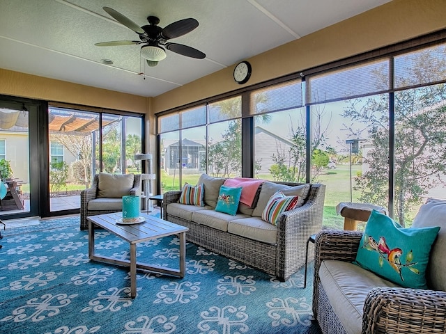 sunroom featuring a ceiling fan