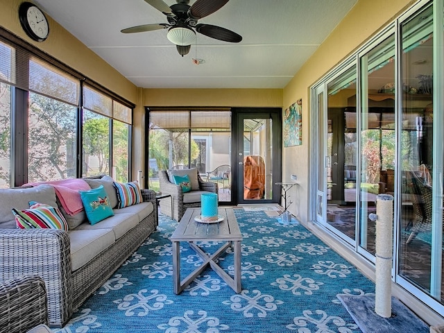 sunroom / solarium featuring ceiling fan