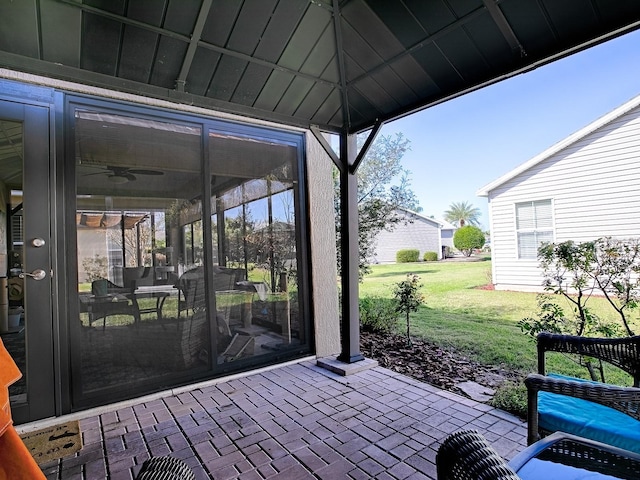 view of patio / terrace featuring a sunroom