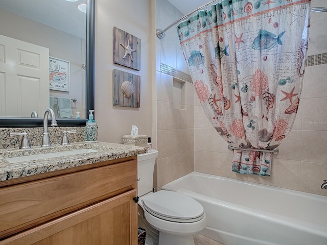 full bathroom with toilet, shower / bath combo with shower curtain, and vanity