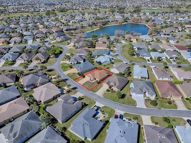 bird's eye view featuring a residential view and a water view