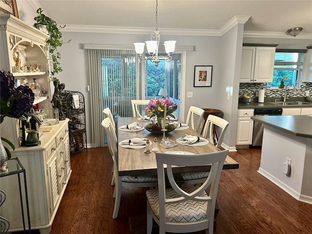 dining space with ornamental molding, plenty of natural light, a notable chandelier, and dark wood finished floors