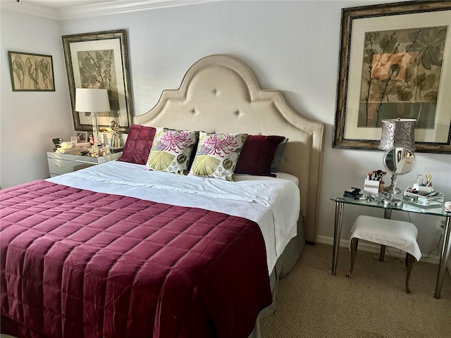 carpeted bedroom with baseboards and crown molding