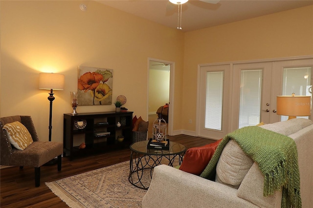 living area with ceiling fan and wood finished floors