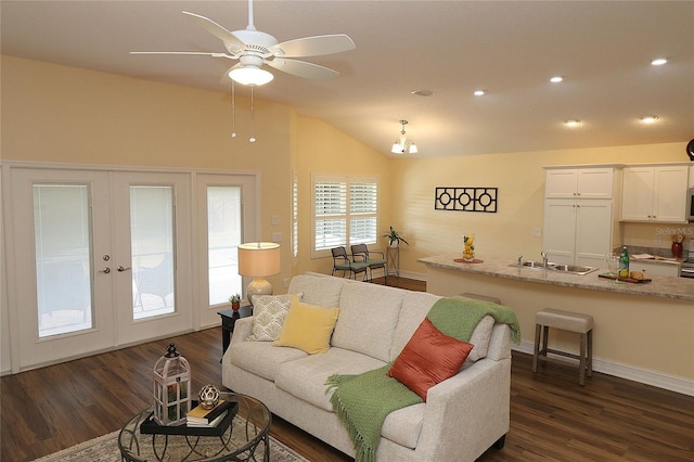 living area with french doors, dark wood finished floors, recessed lighting, a ceiling fan, and vaulted ceiling