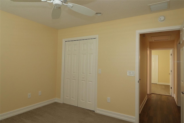 unfurnished bedroom with a ceiling fan, a closet, visible vents, and baseboards