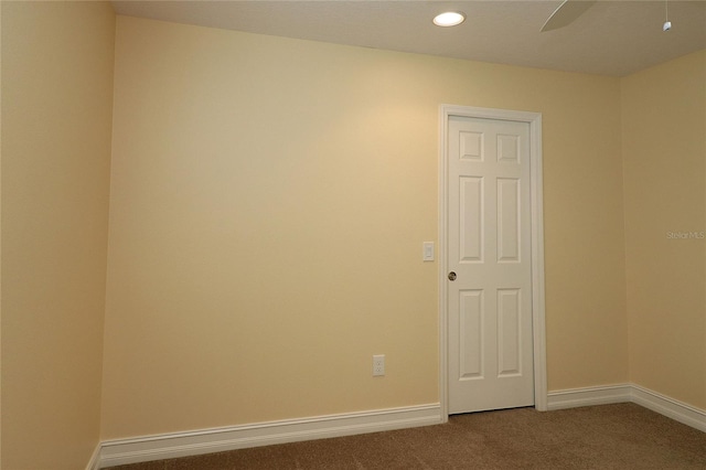 empty room with carpet floors, recessed lighting, baseboards, and a ceiling fan