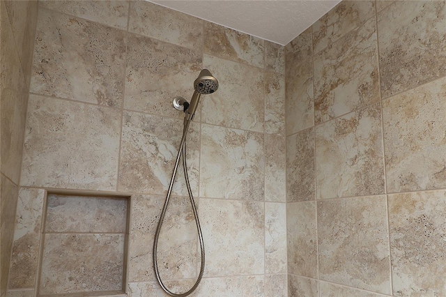 room details featuring a tile shower