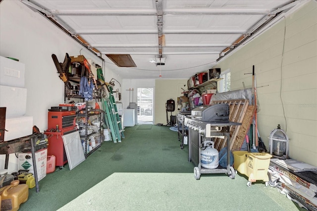 garage featuring washer / clothes dryer and a garage door opener