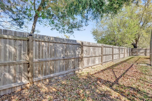 view of yard featuring a fenced backyard