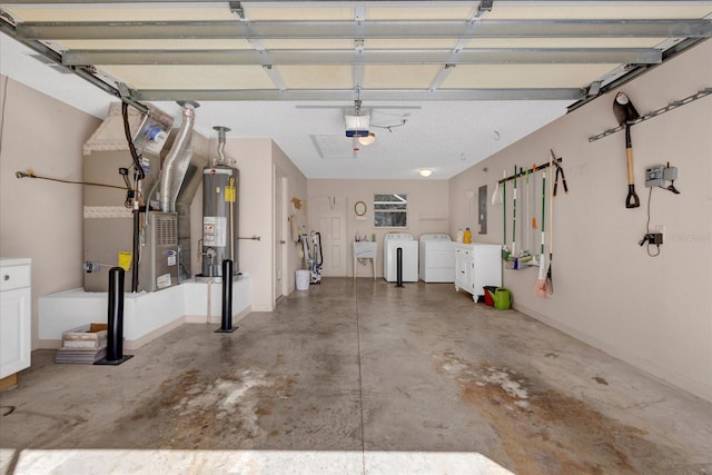 garage featuring heating unit, a garage door opener, water heater, a sink, and independent washer and dryer