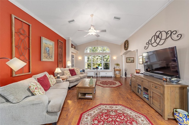 living room featuring ornamental molding, visible vents, vaulted ceiling, and light wood-style flooring