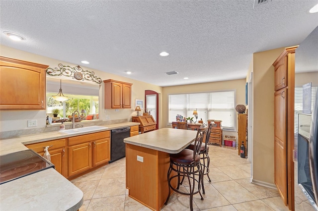 kitchen featuring arched walkways, black dishwasher, a center island, a sink, and a kitchen bar