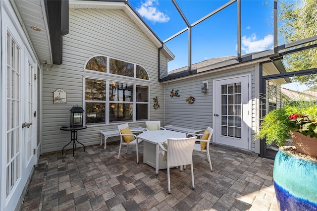 view of patio / terrace with a lanai and outdoor dining space