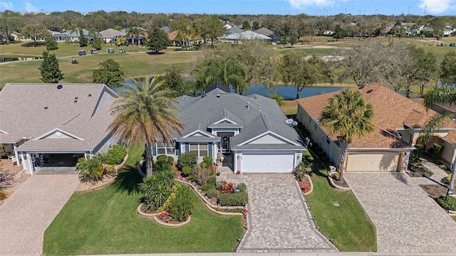 bird's eye view featuring a residential view and a water view