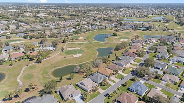 birds eye view of property with a residential view, view of golf course, and a water view