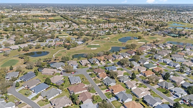 birds eye view of property with a residential view, view of golf course, and a water view