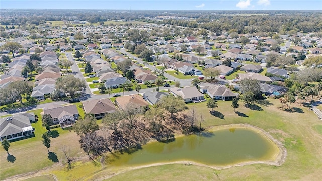 bird's eye view featuring a water view and a residential view