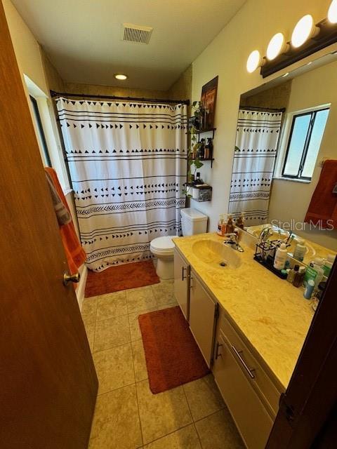 bathroom featuring visible vents, toilet, tile patterned floors, mail area, and vanity