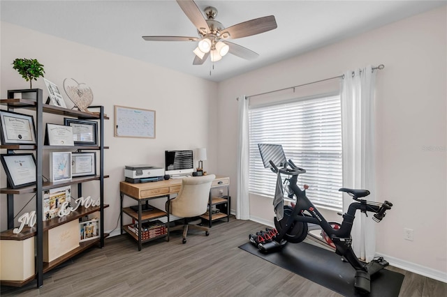 office area with ceiling fan, wood finished floors, and baseboards