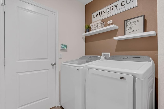 washroom with laundry area and washer and clothes dryer