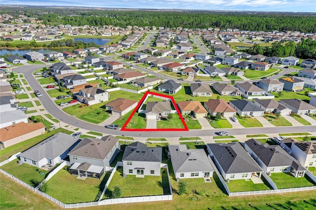 birds eye view of property featuring a residential view and a water view