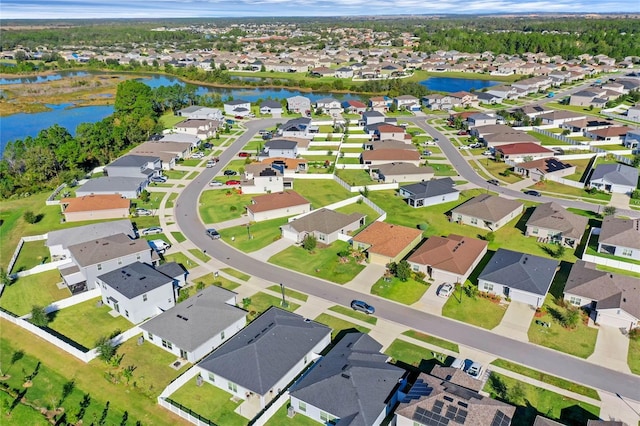 birds eye view of property with a residential view and a water view