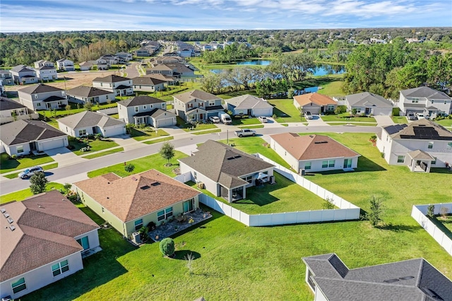 birds eye view of property with a water view and a residential view